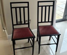 Pair of black wooden Edwardian casual chairs with velvet seats