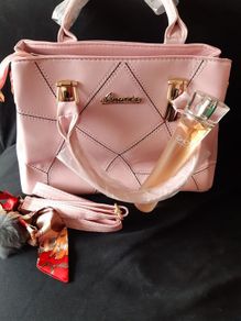 Bottle of Perfume and New Handbag