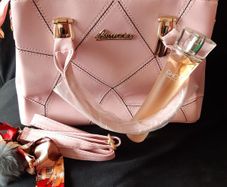 Bottle of Perfume and New Handbag