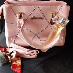 Bottle of Perfume and New Handbag