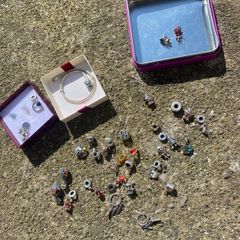 Charm beads that fit on a snake chain bracelet selection