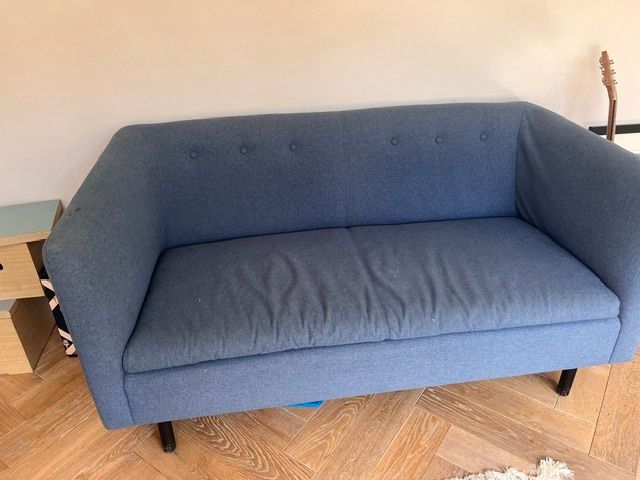 Blue two-seater sofa - button back detail