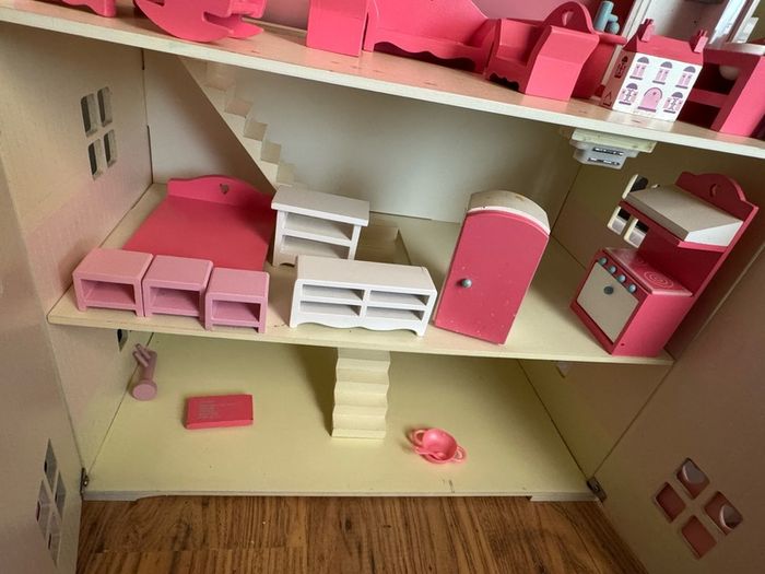 girl's doll house with pretend play furniture