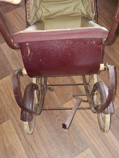 Antique Burgundy Doll's Pram, Manufactured by Walker around the 1940s, It features a Coach-Built Style Carriage with distinctive Wire-Spoke Wheels and Hard Rubber Tires Collection Only