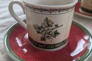 Vintage Villeroy and Boch coffee cups and saucers in Festive Memories pattern.