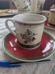 Vintage Villeroy and Boch coffee cups and saucers in Festive Memories pattern.