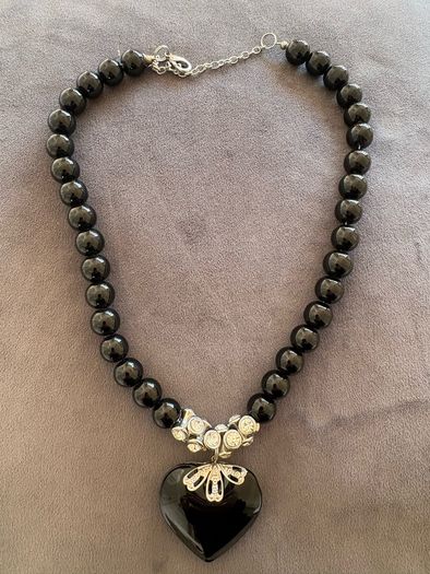 Black necklace with large black heart pendant