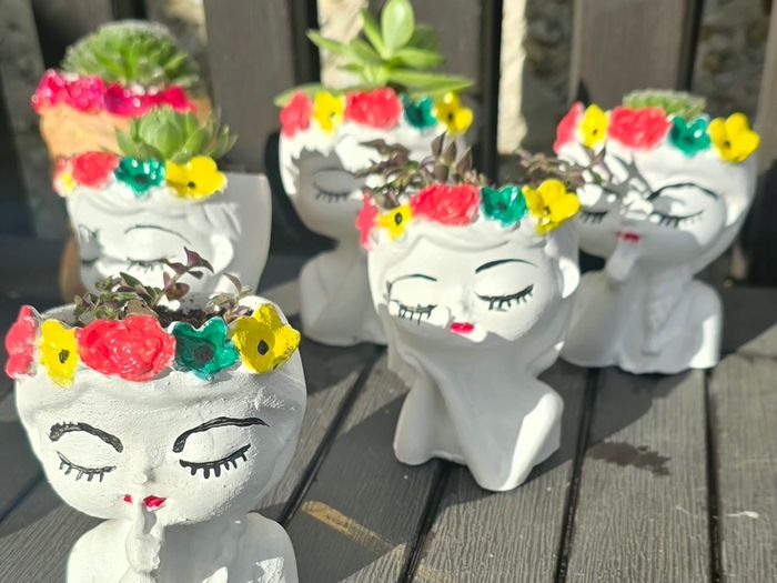 small handmade flower pots with real plants