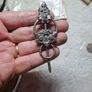 St Justin pewter broach. Image 3
