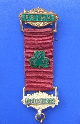 ORDER OF THE LADIES GLADE (OLG) - PRIMA degree White Rose member's medal (1978). Inscribed with recipient's name. A scarce medal.