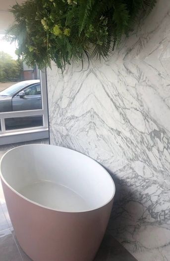 Freestanding stone bath