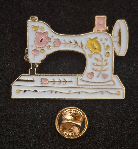 Sewing machine, pin back badge.