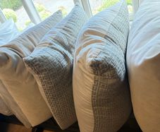 8 large Feather Filled Cushions