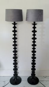 Contemporary pair of black bobbin floor lamps