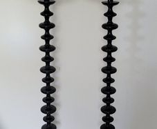 Contemporary pair of black bobbin floor lamps