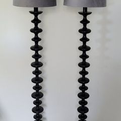 Contemporary pair of black bobbin floor lamps