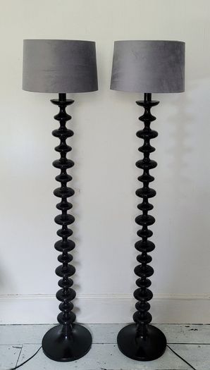 Contemporary pair of black bobbin floor lamps