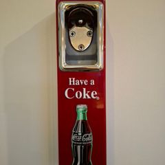 Vintage Coca-Cola wall-mount bottle opener and cap catcher