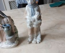 Porcelain  Figurines  X 2. Boy With  Lamb & Lady With Urn.