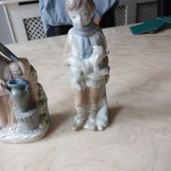 Porcelain  Figurines  X 2. Boy With  Lamb & Lady With Urn.