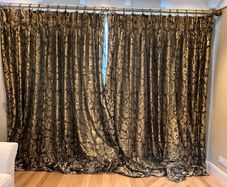 Pair of large lined black and gold curtains