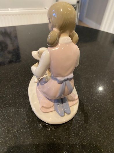 Annie Rowe figure girl brushing dog