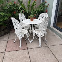 cast iron table and chairs