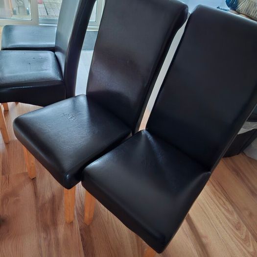 4 Black leather style kitchen chairs. Very few scuff marks 80