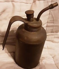 small vintage indoor watering can