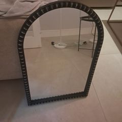 Arched wall mirror with decorative beaded frame
