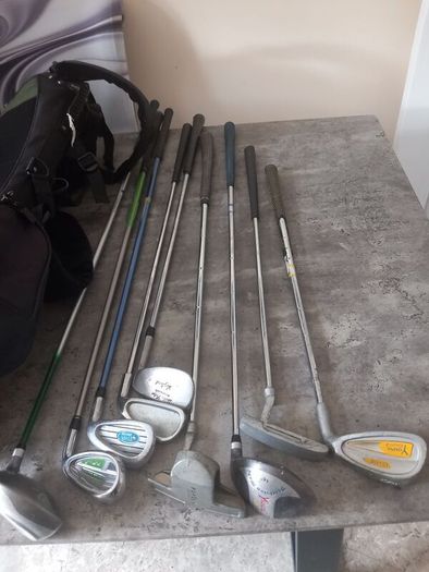 A selection of junior golf clubs and bag.