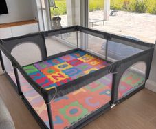 2mx1.8m Playpen with floor tiles, balls and pulls.