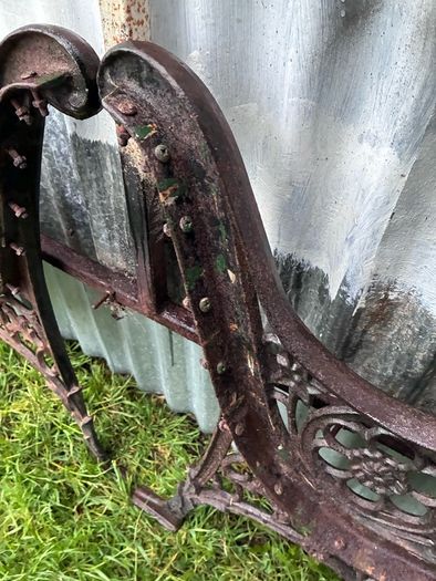 Pair of decorative cast iron bench ends