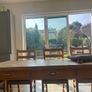 Solid oak dining table and 8 chairs with storage drawers Image 3