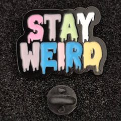 Stay weird,  pin back badge.