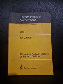 Generalized Analytic Functions on Riemann Surfaces