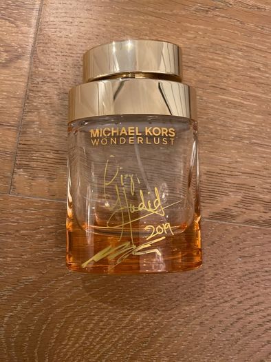 Empty perfume bottle signed by Michael Kors & Gigi Hamid