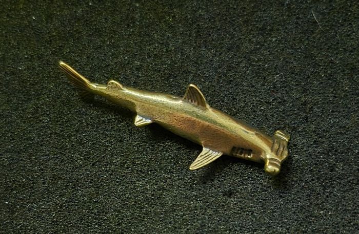 3 brass fish.