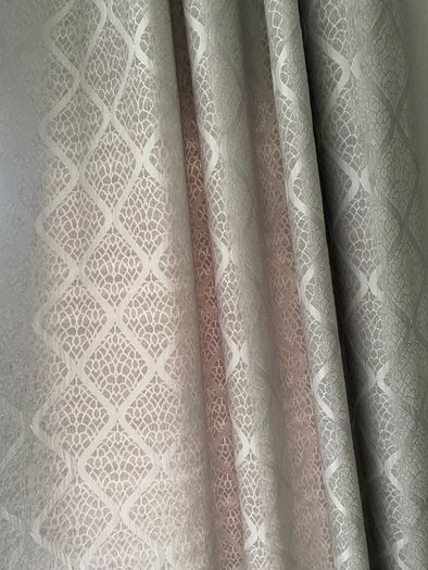 Grey patterned eyelet curtains