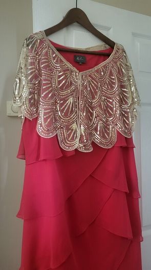 Plus size wedding  guest  dress in coral .
