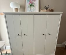 Ikea White storage cabinet Idanas with bi-folding doors