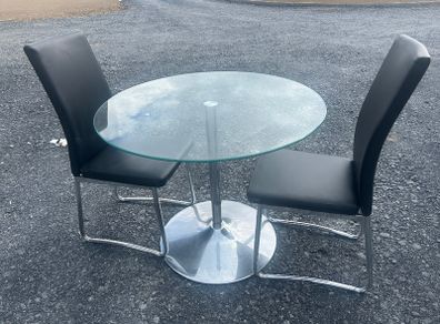 Glass table and two chairs
