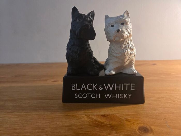 Black and white whiskey statue