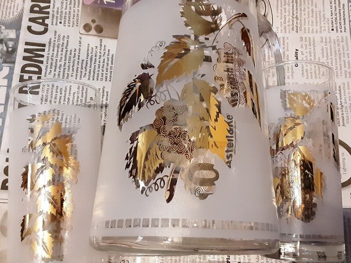 Vintage jug and four glasses