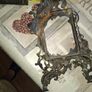 Beautiful Pair of Antique Art Nouveau Beatrice. Bronzed Photo Frames Cherub. a stunning lady lies on the top of the frame with beautiful scrollwork descending down the frame to a winged Cupid or Angel Image 8
