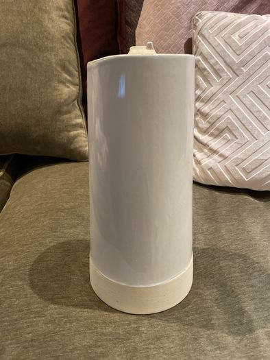 Tall white vase for flowers with house detail