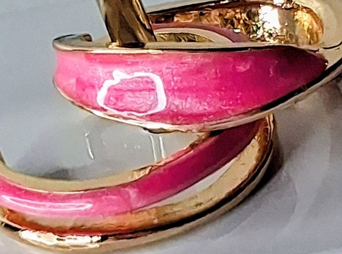 A Pair of Pink Oil Drip Rings with Open Ring & Twist Ribbon Ring