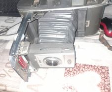 Vintage Large Polaroid Electric Eye Land Camera Model 900, Manufacture between 1960 and 1963. Key Features: Top of the line automatic shutter model featuring a folding bellows design and electric eye light metering