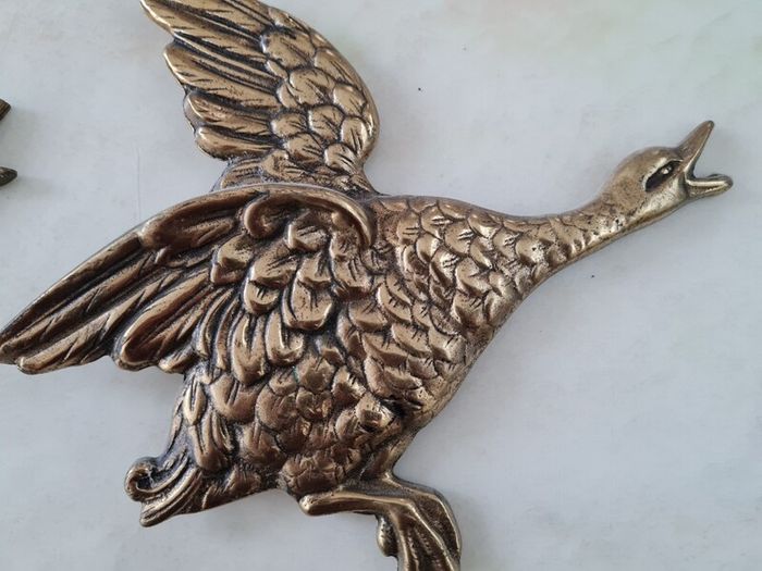 brass flying ducks