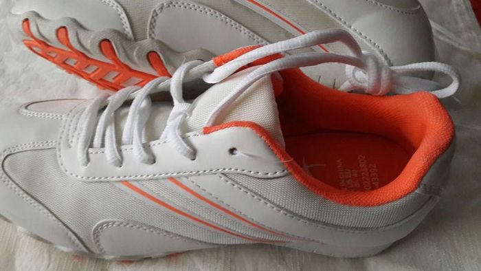 New white runners with tag